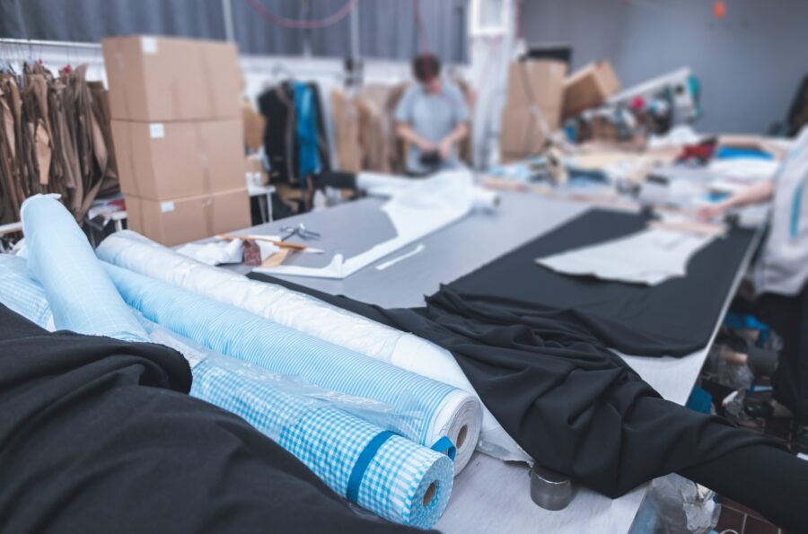 clothing-manufacturing-facility-with-fabric-table-min clothing-manufacturing-facility-with-fabric-table-min